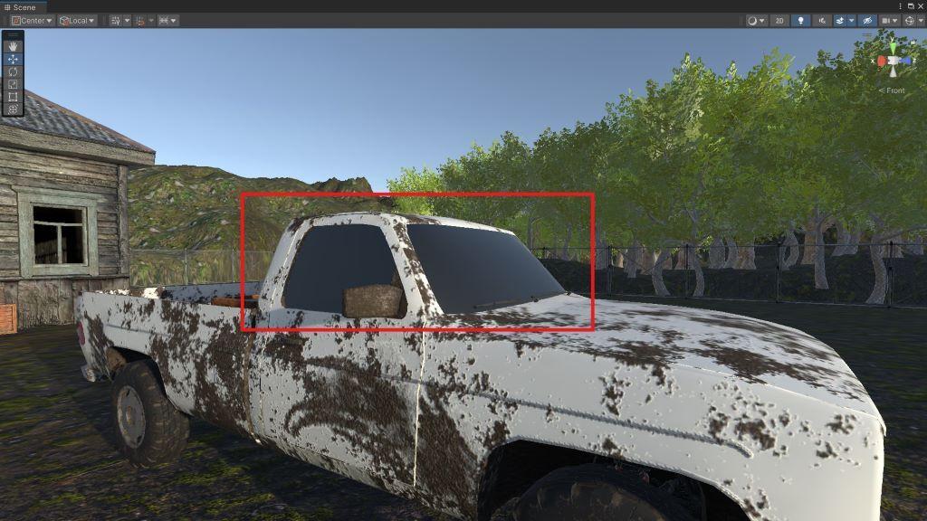 A muddy, white pickup truck with dark windows.