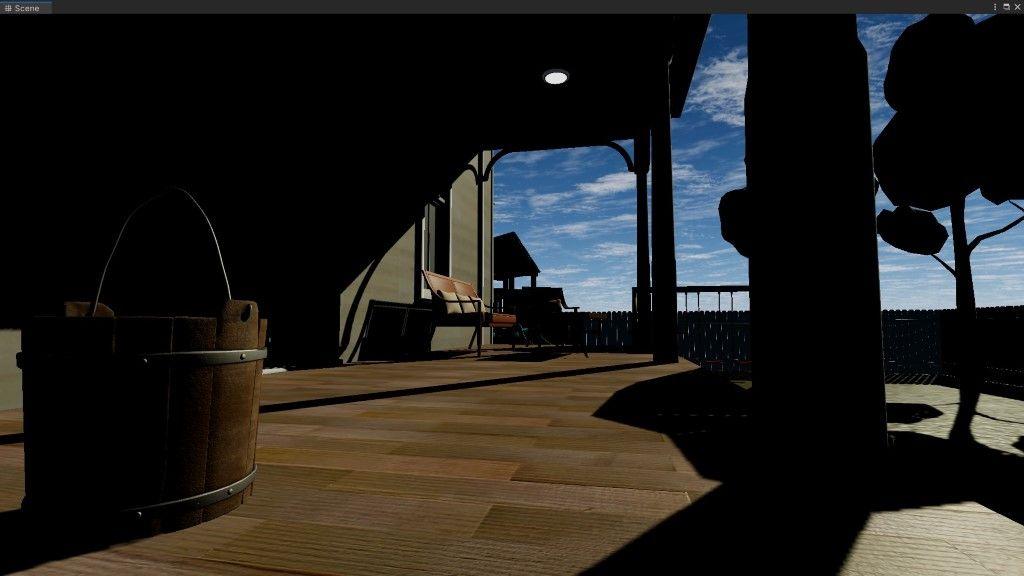 A front yard with a blue sky and dark objects.